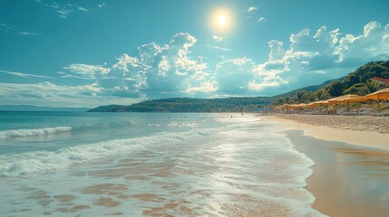 Fototapeta premium A scenic view of a sandy beach with turquoise water and a bright blue sky, sun shining down on the scene with clouds in the distance.