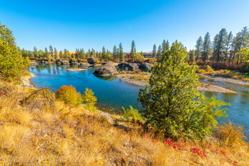 The Spokane River at autumn at the Islands Trailhead park along the Centennial Trail in Spokane, Washington, USA