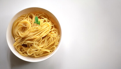 Spaghetti pasta in a white bowl on side position provides copy space for text. background concept isolated white