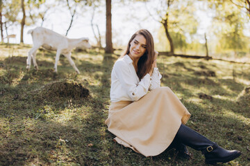 Woman Relaxing Outdoors in Nature, Enjoying Tranquility and Fresh Air on a Sunny Day in the...