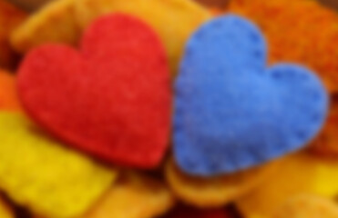 intentionally blurred hearts one red and one blue perfect as background for love and hearts concept