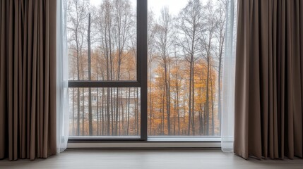 Looking through a white plastic window, vibrant autumn trees display their foliage against a modern urban backdrop