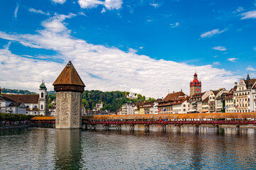 Naklejka premium Historic center of Lucerne with famous Chapel Bridge. Lucerne city view. Lucern Switzerland. Sunrise in historic city center of Lucerne with famous lake Lucerne.