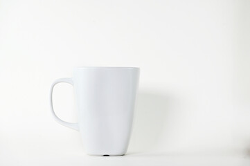 white ceramic coffee cup with handle