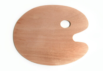Wooden artist palette for paint. Waiting for the artist, unused painting palette on white...