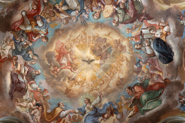  ASTI, ITALY - SEPTEMBER 11, 2024: The central part of fresco in cupola (Holy Trinity among the...