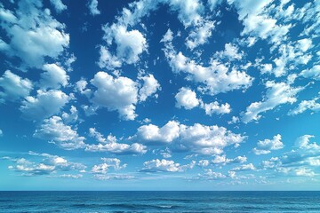 Fototapeta premium Blue Sky with White Puffy Clouds Over a Calm Ocean