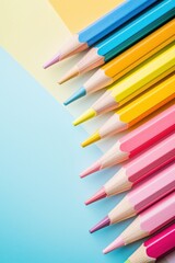 Obraz premium A row of colorful pencils on a blue background