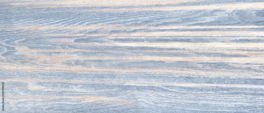 Poster a wooden surface with a blue and white pattern. the blue and white pattern is very light and the woo