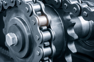 Gear chain drive shaft in conveyor belt is on production line. Timing chain of car, tensioners in...