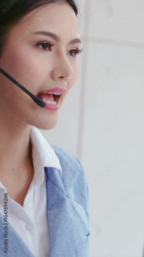 Poster customer support agent or call center with headset works on desktop computer while supporting the cu