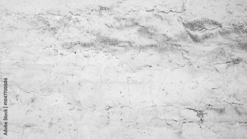 Aufkleber a white wall background with cracks and holes. the wall is made of concrete and has a rough texture