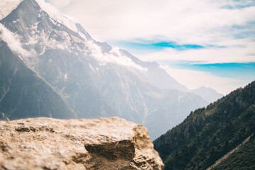 Breathtaking View Of The Mont Blanc Massif, The Highest Peak In The Alps, Seen From A Rocky Cliff In The French Alps On A Sunny Day. Perfect For Displaying Products Or Adding Text