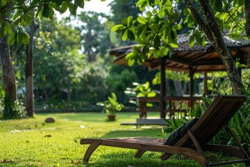 Obraz premium A simple lawn chair sits amidst a vibrant green field, perfect for outdoor relaxation