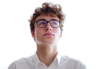 Fototapeta premium A young man with glasses and a white shirt, suitable for use in education or professional settings