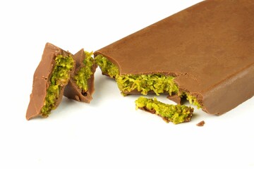 Dubai chocolate bar with green pistachio nuts kadaif dessert.