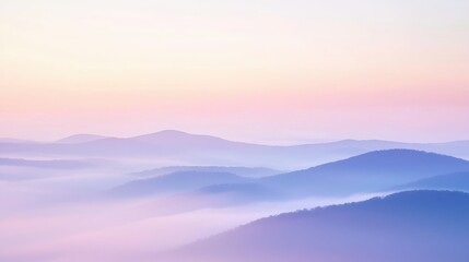 Obraz premium Pastel Sunrise Over Rolling Hills with Soft Mist