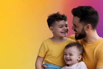 Father having fun with his two young children against a colorful background