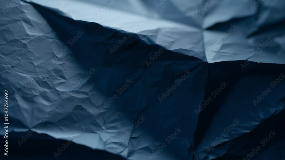 Poster A delicate close-up of dark fabric reveals intricate textures and subtle wrinkles, showcasing how light interacts with the material in an indoor space.