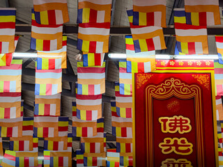 Colorful Buddhist Flags Beautifully Hanging Indoors, Creating a Unique Atmosphere of Peace
