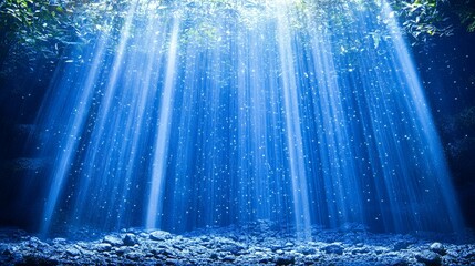 Sunlight beams through the water in a mystical underwater scene.