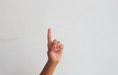 Finger 3. A man's hand points one finger