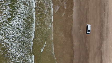 The waves large and small continue to lap on shore of the beaches along the Gulf of Mexico in Port...