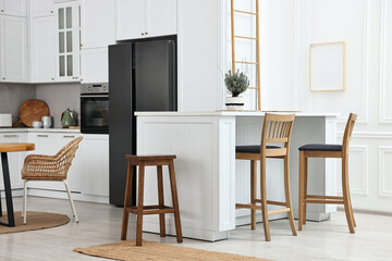 Stylish kitchen with bar stools. Interior design