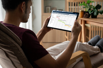 Project planning software for modish business project management on the computer screen showing timeline chart of the team project