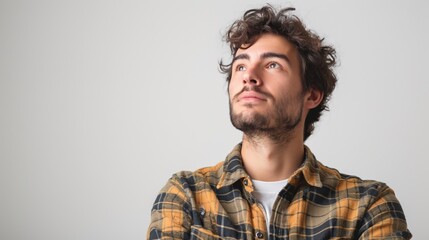 Obraz premium Thoughtful Young Man in Casual Attire