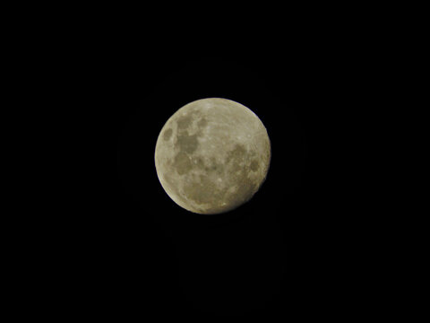 Gibbous Moon (waxing to full moon), floating under the night sky in the southern hemisphere.