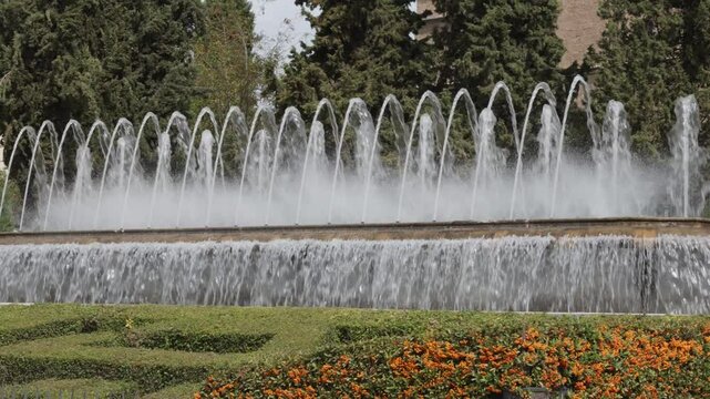 The Elegant Fountain in a Lush Garden captivates visitors with its stunning visual experience