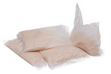 A Plastic Bags of White Long Grain Rice - Isolated on White Background. Small Transparent Packages with Dry Rice - Isolation