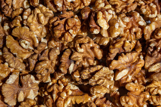 Scattered Shelled Walnuts. Background from Walnut. Natural High-Calorie Snacks