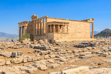 The ruins of a building are surrounded by a field of rocks, Acropolis in Athens