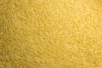 Uncooked Filini Pasta: A Culinary Canvas of Noodles, Creating a Lively and Textured Background for Gourmet Cooking. Dry Pasta. Raw Macaroni - Top View, Flat Lay