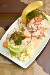 Fish ceviche and rice with seafood, traditional Peruvian dish of fish and seafood