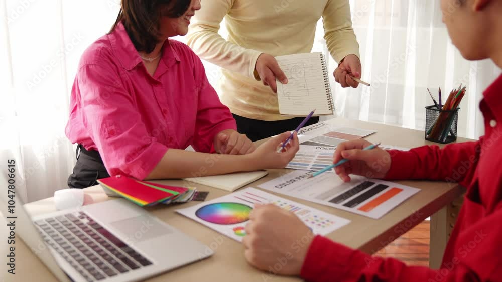 Poster slow motion designer team brainstorming and choosing color for graphic design working or client aski