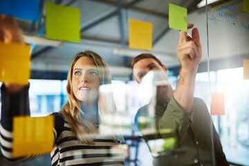 Creative, people and writing notes on glass wall of planning, future ideas and business schedule....