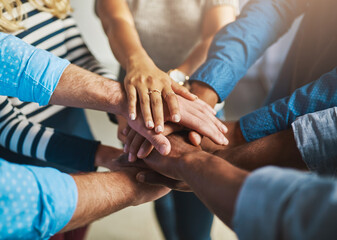 Hands, team and stack at office for support, solidarity or goal with connection at media company....