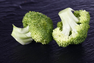 Broccoli isolated isolation on the black SLATE