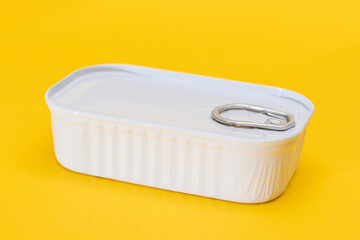 Tin Can on Yellow Background. Canned Food. Aluminum Can for Safe and Long Term Storage of Food. Steel Sealed Food Storage Container