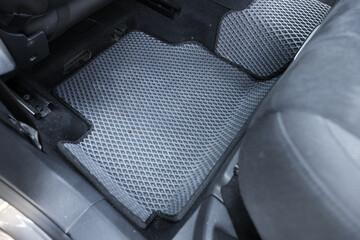 Grey rubber car floor mat in auto