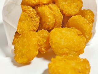 Deep fried hash brown on white background. Junk food menu. Unhealthy food concept. American food