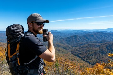 A hiker taking a sip from a canteen, standing on a scenic overlook with mountains and valleys in the distance