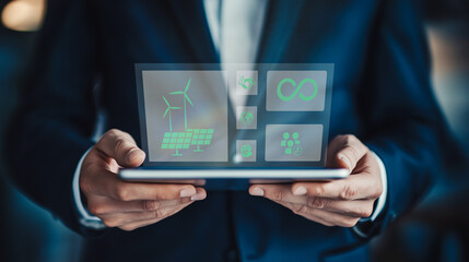Fototapeta premium Business professional holding a tablet showcasing digital interfaces for renewable energy solutions, including wind power and efficiency metrics.