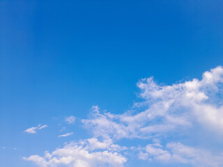 Obraz premium Clear blue sky and white clouds. Beautiful daylight natural sky composition. Heavenly light