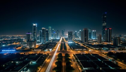 Fototapeta premium Vibrant cityscape at night illuminated by bright lights and neon signs