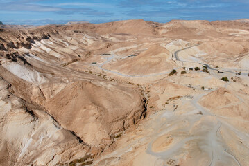 Hills surrounded Masada Fortress, a fortification at Judea Desert, near Dead Sea. It was fortified Masada in 31 BCE, where 960 sicarios committed suicide during a siege by Roman troop. Israel, 2016.