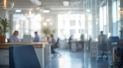 Modern office, long floor to ceiling windows, busy company staff